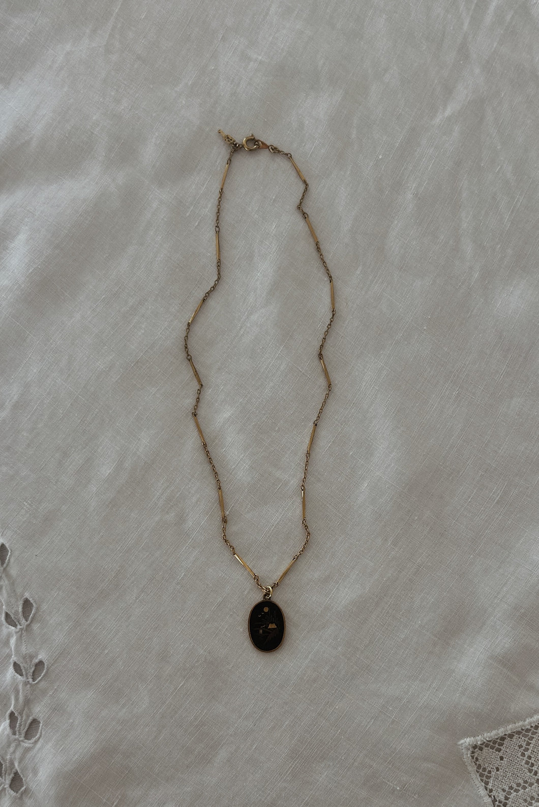 1940's BLACK + GOLD DAMASCENE PENDANT ON 1970's GOLD FILL CHAIN