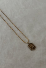1930's BRASS RUNNER PENDANT ON 1970's GOLD FILL CHAIN