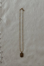 1930's BRASS RUNNER PENDANT ON 1970's GOLD FILL CHAIN