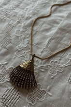 1980's BRASS COATED SHELL PENDANT ON GOLD VERMEIL CHAIN