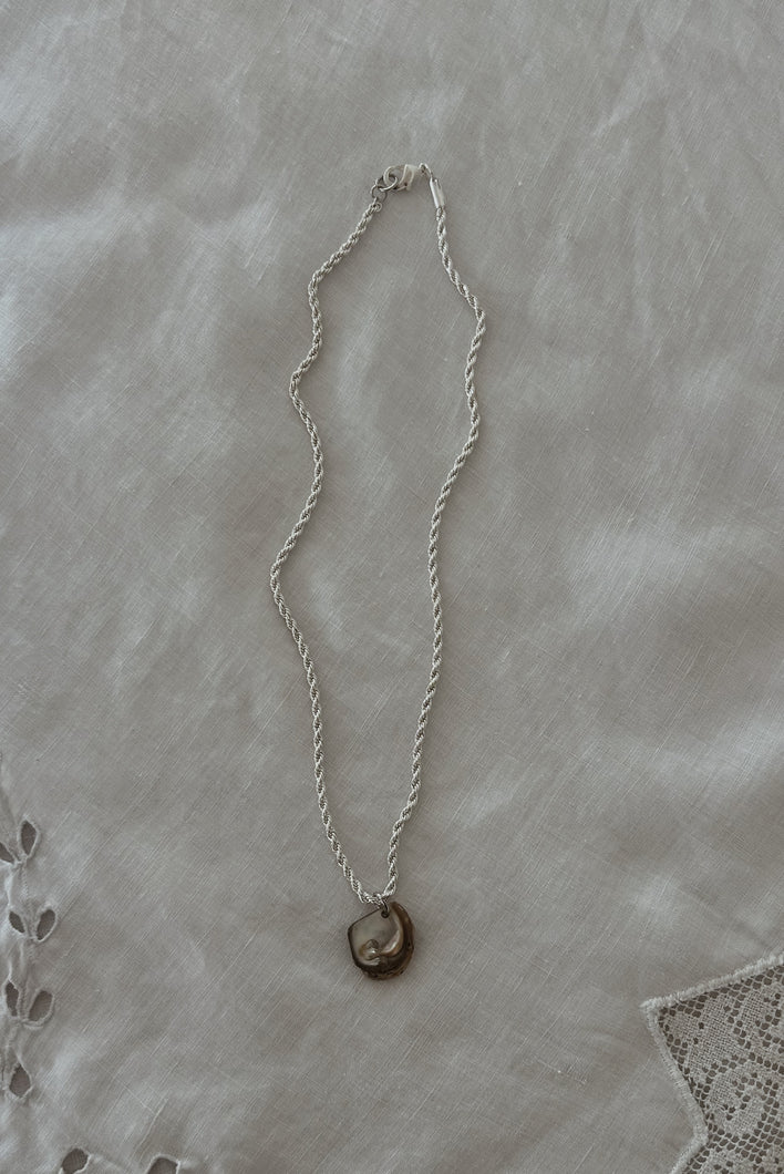 1990's MOTHER OF PEARL SHELL PENDANT ON SILVER PLATE TWIST CHAIN