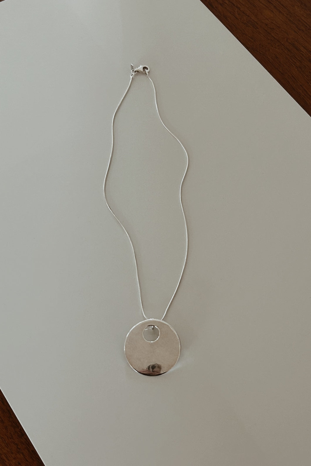 1980's SOLID STERLING DISC PENDANT ON LIQUID STERLING CHAIN